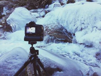 Camera on frozen river during winter