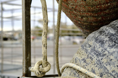 Close-up of rope tied on metal