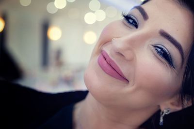 Close-up portrait of woman smiling