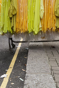 Yellow shirts covered in plastic in rack