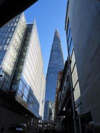 Low angle view of modern buildings against clear sky