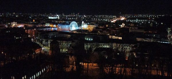 Illuminated buildings in city at night