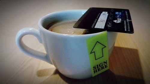 Close-up of coffee cup on table