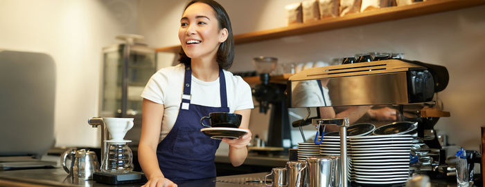 Portrait of young woman working at home