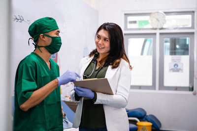 Female doctor examining patient at clinic