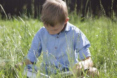Close-up of boy on field