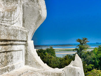 Scenic view of sea against clear blue sky