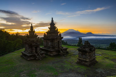 Ancient temple against sky during sunrise