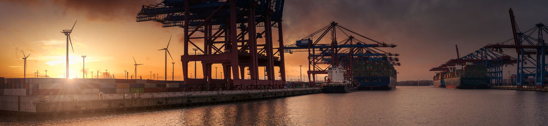 View of commercial dock against sky during sunset