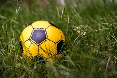 Close-up of soccer ball on field