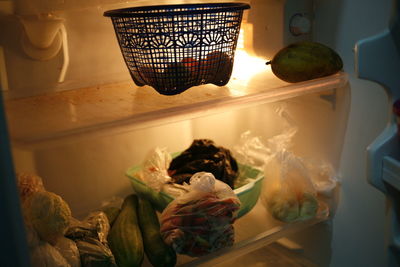 Close-up of fruits served on refrigerator