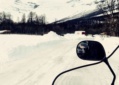 Road passing through snow covered landscape