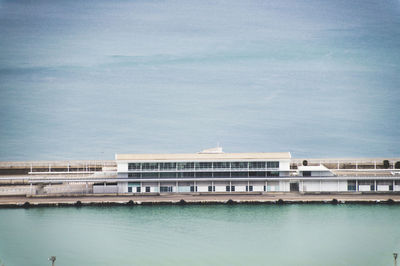 Aerial view of building at harbor in sea