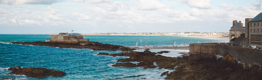 Panoramic view of sea against cloudy sky