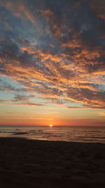 Scenic view of sea against sky at sunset