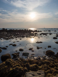 Scenic view of sea against sky at sunset