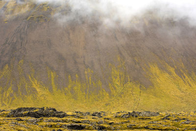 Scenic view of mountain during foggy weather