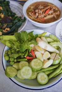 High angle view of chopped vegetables in bowl on table