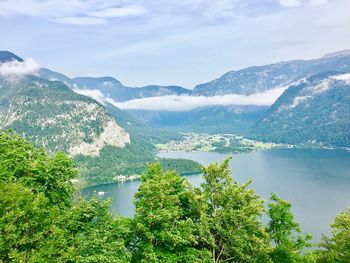 High angle view of lake and mountains against sky