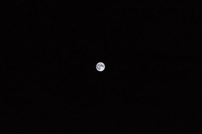 Low angle view of moon against sky at night