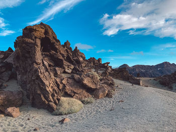 Rock formation on land against sky