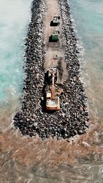 High angle view of stones in sea