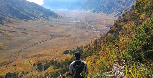 Rear view of man looking at mountain