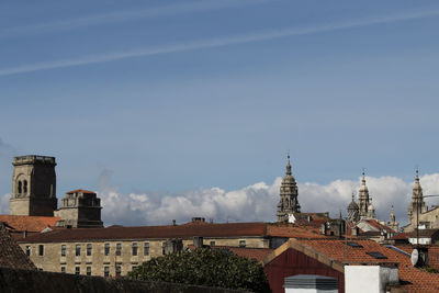 Buildings in city against sky