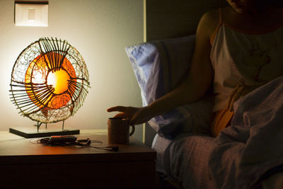 Low section of man sitting at home