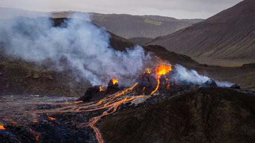 Smoke emitting from volcanic mountain