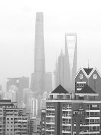 Buildings in city against sky