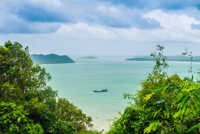 High angle view of boats in sea against sky