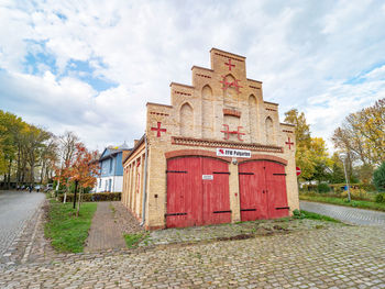 Kap arkona, historical firehouse with two gates for fire engines in old fishing village putgarten.