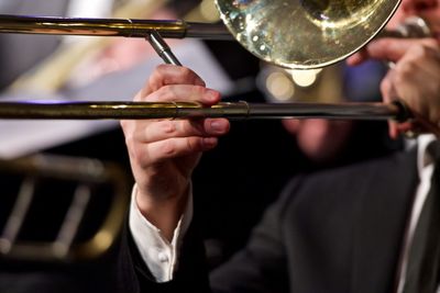 Close-up of musicians playing trumpet