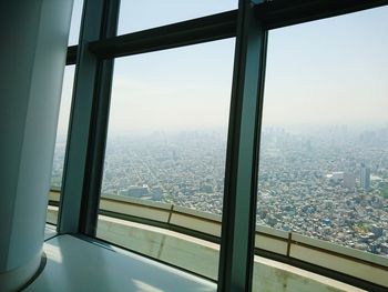 View of cityscape through window