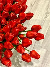 High angle view of red roses on table