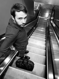 High angle view of man on escalator