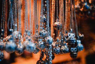 Close-up of clothes hanging on metal for sale