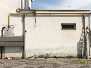 Exterior of building by street against sky