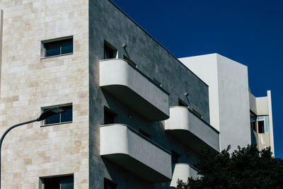 Low angle view of building against blue sky