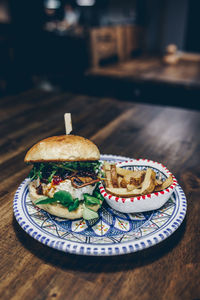 High angle view of burger in plate on table