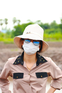 Portrait of man wearing sunglasses standing outdoors