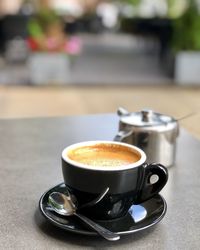 Close-up of coffee cup on table