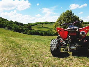 Tractor on field against sky