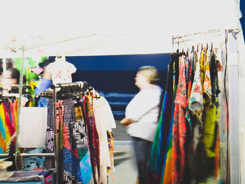 Panoramic view of clothes hanging at market stall
