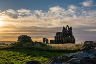 Old ruin building against cloudy sky