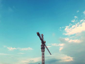 Low angle view of communications tower against sky