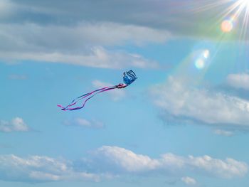 Low angle view of kite flying in sky