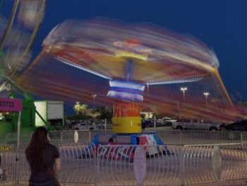 Blurred motion of woman at night