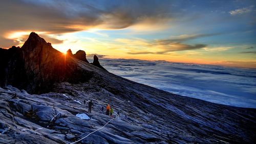 Scenic view of mountain peak at sunset